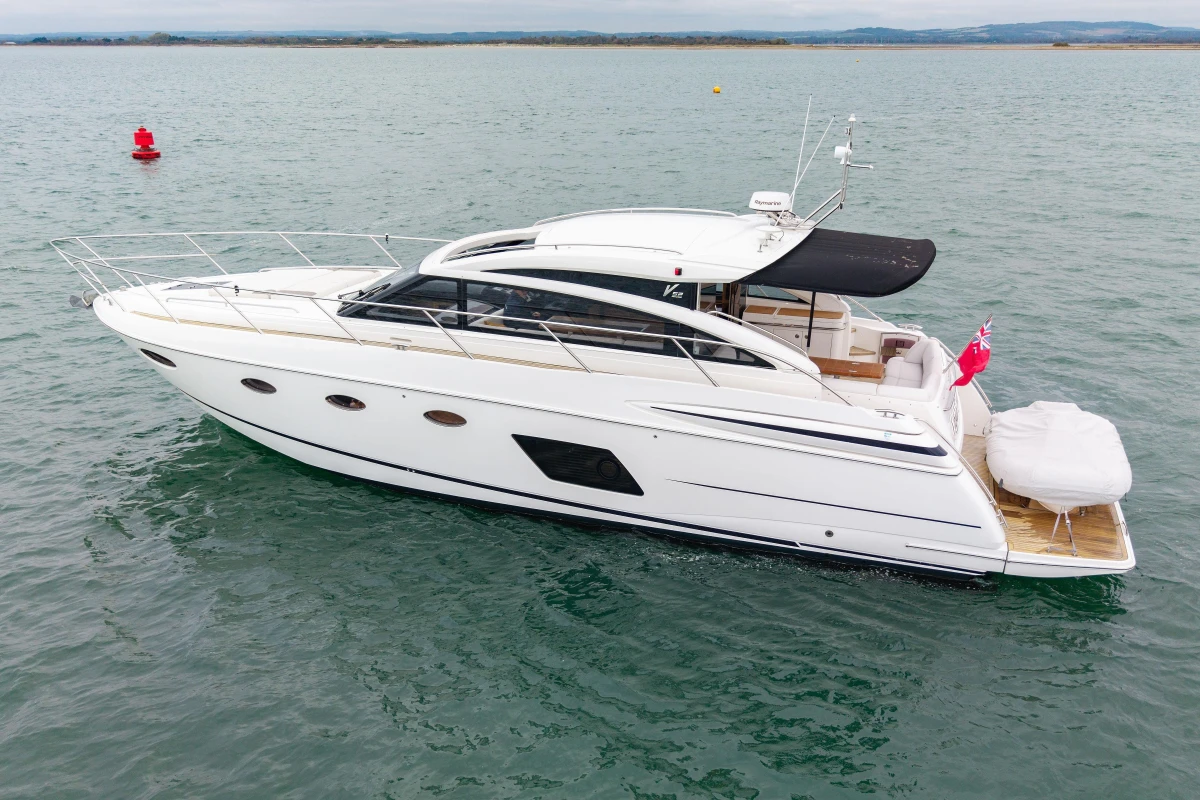2014 Princess V52 yacht cruising on open water, side view.