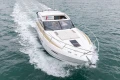 2014 Princess V52 yacht cruising on open water, showcasing sleek design and luxury.