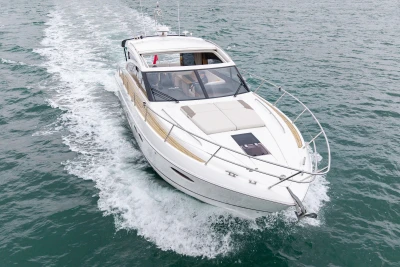 2014 Princess V52 yacht cruising on open water, showcasing sleek design and luxury.