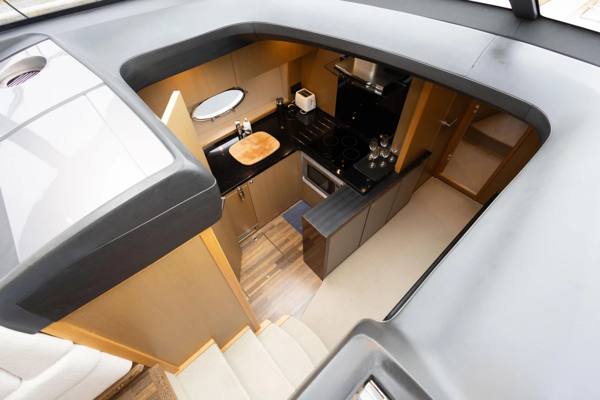 Luxurious 2014 Princess V52 yacht interior kitchen with modern amenities and sleek design.