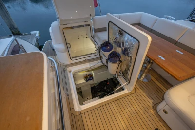 2014 Princess V52 yacht interior with open storage compartments on deck.