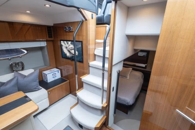 Luxurious interior of 2012 Princess V52 yacht with cozy cabin and elegant wooden finishes.