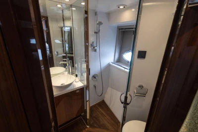 Luxurious bathroom in 2012 Princess V52 yacht with modern fixtures and wooden accents.