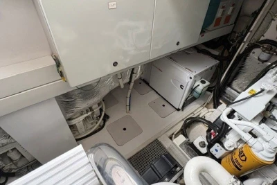 Engine room of a 2013 Princess V52 yacht, showcasing machinery and equipment.