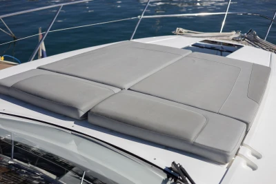 Sunbathing cushions on 2017 Princess V40 yacht deck, with ocean view.
