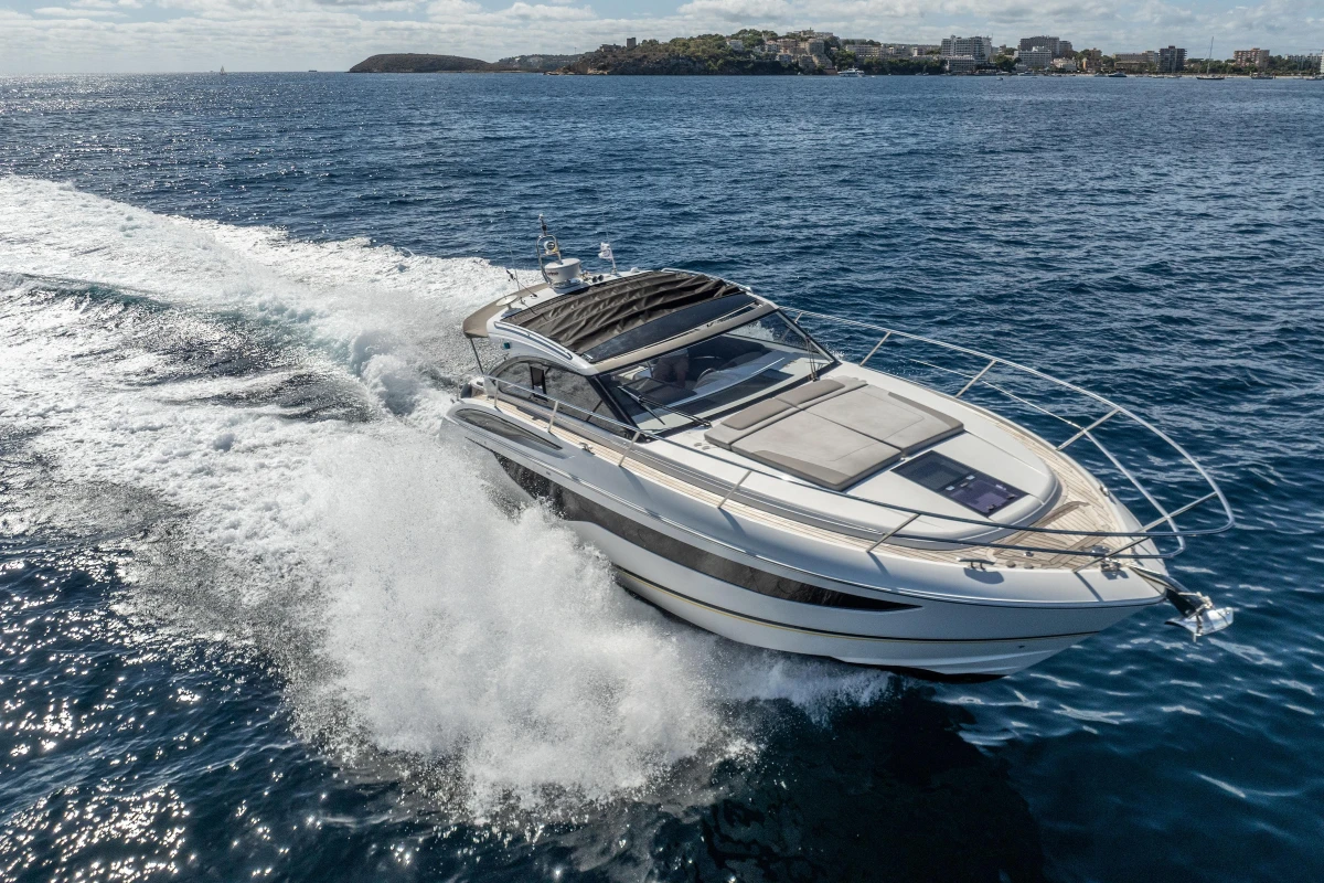 2017 Princess V40 yacht cruising on open water, creating a dynamic wake.