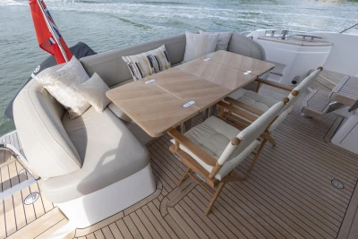 Deck area of the Princess F55 with dining table and seating.