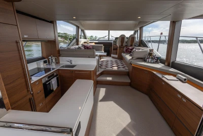 Interior of the Princess F55 yacht featuring a modern kitchen and stylish living area.