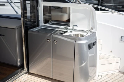 Outdoor kitchenette on 2026 Princess V50 yacht, featuring sleek design and modern amenities.