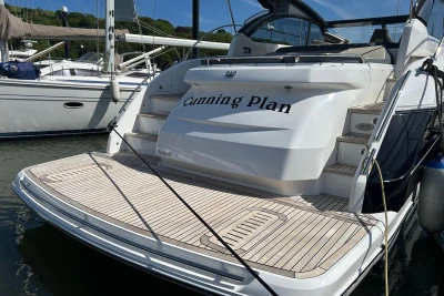 2017 Princess V48 Open yacht docked, featuring spacious deck and elegant design.
