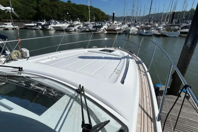 2017 Princess V48 Open yacht docked at a marina, surrounded by other boats.