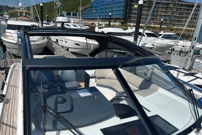 2017 Princess V48 Open yacht docked at a marina, showcasing sleek design and luxury features.