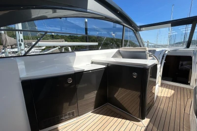 2017 Princess V48 Open yacht interior with sleek cabinetry and teak flooring.