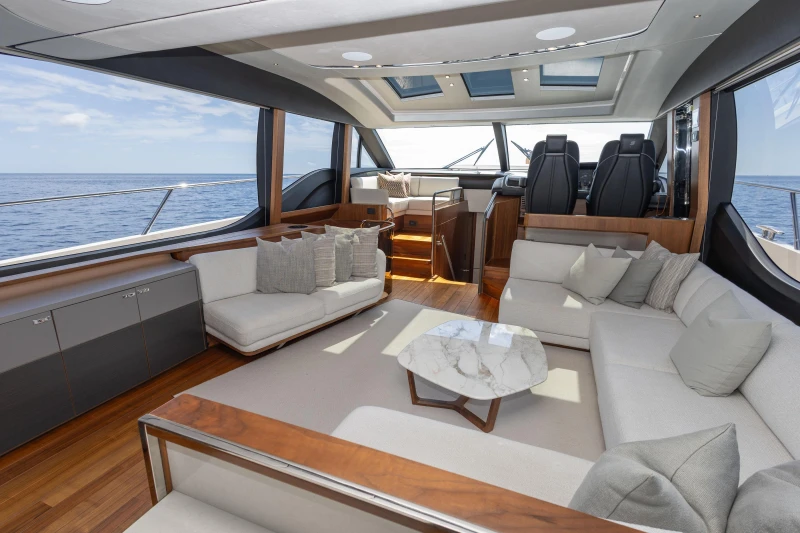 Luxurious interior of 2022 Princess S78 yacht with elegant seating and ocean view.