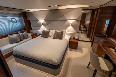 Luxurious 2022 Princess S78 yacht bedroom with modern design and elegant furnishings.