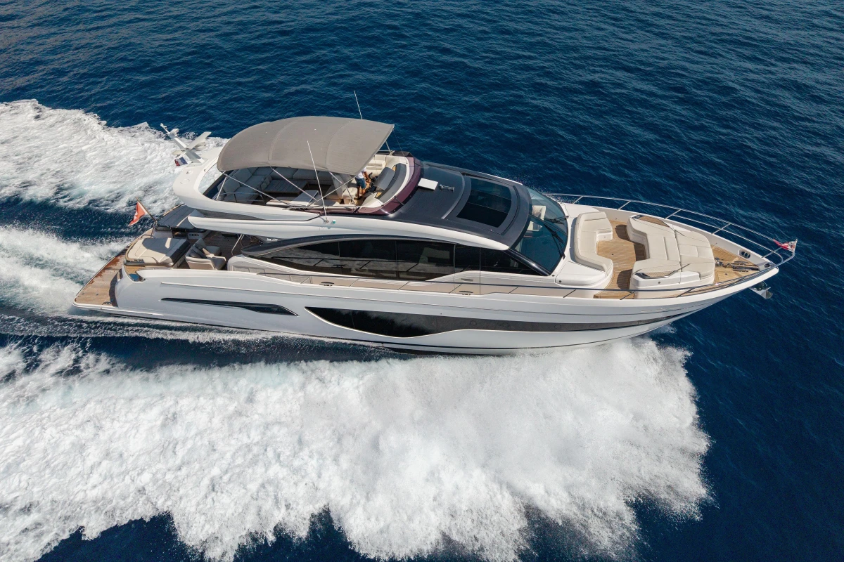 Luxurious 2022 Princess S78 yacht cruising on open sea, showcasing sleek design and elegance.