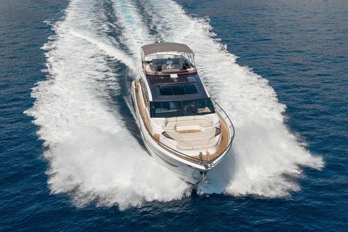 Luxurious 2022 Princess S78 yacht cruising on open sea, showcasing sleek design and performance.