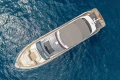 Aerial view of 2022 Princess S78 yacht on blue ocean water.