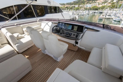 Luxurious 2022 Princess S78 yacht interior with elegant seating and advanced navigation controls.