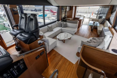 Luxurious interior of 2022 Princess S78 yacht with modern seating and elegant design.