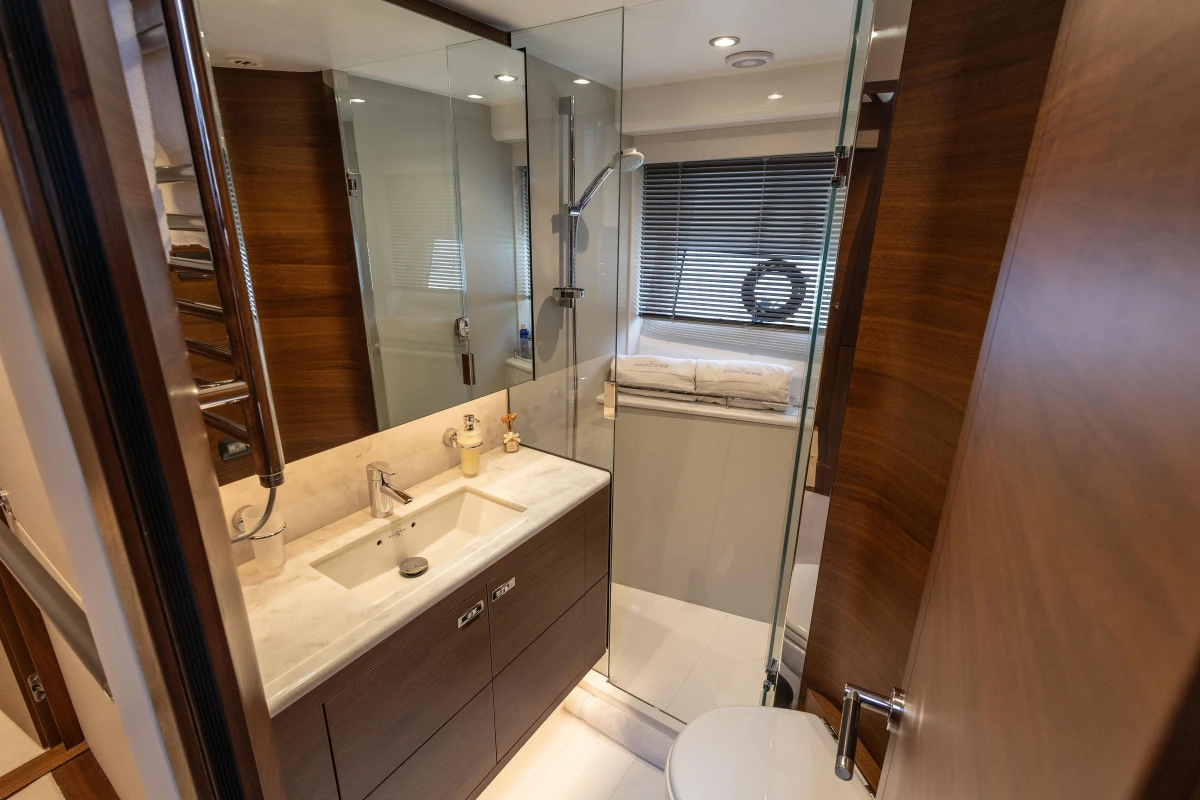 Luxurious bathroom in 2022 Princess S78 yacht with modern fixtures and elegant wood accents.