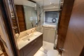 Luxurious bathroom in 2022 Princess S78 yacht with modern fixtures and elegant wood accents.