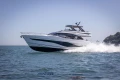 2023 Princess S72 yacht cruising on open water, showcasing sleek design and luxury.