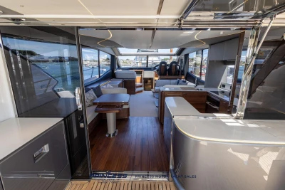 Luxurious interior of 2023 Princess S72 yacht with modern design and spacious seating.