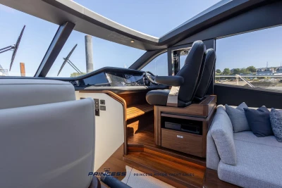 Interior of 2023 Princess S72 yacht showcasing helm and seating area.