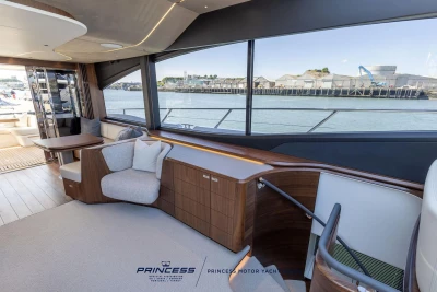 Luxurious interior of 2023 Princess S72 yacht with waterfront view.