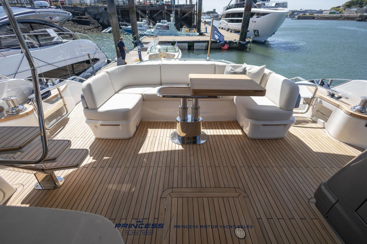 Luxurious 2023 Princess S72 yacht deck with elegant seating and wooden flooring.