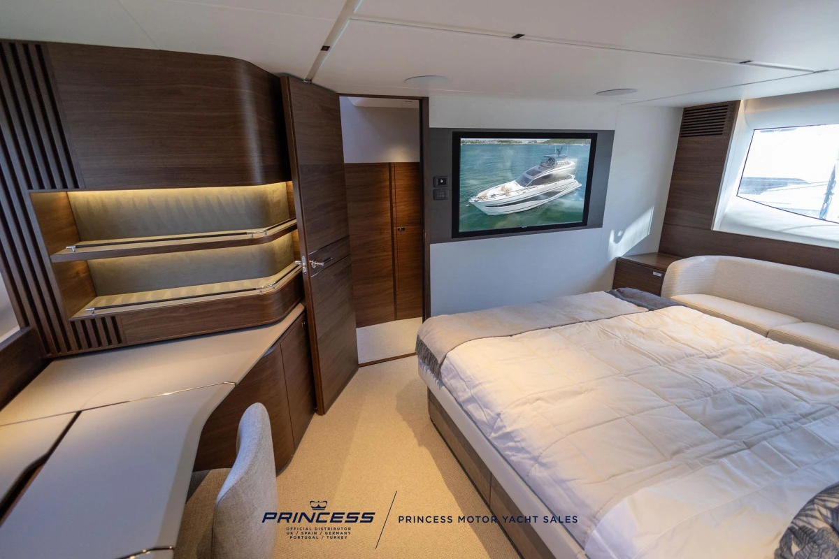 Luxurious 2023 Princess S72 yacht bedroom with modern design and elegant furnishings.