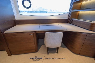 Luxurious interior of 2023 Princess S72 yacht with elegant wood finish and modern design.