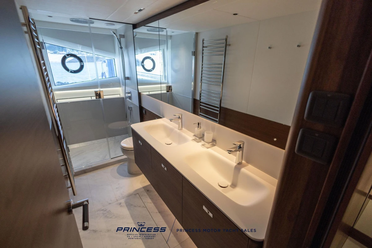 Luxurious bathroom in 2023 Princess S72 yacht with dual sinks and modern fixtures.