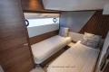 Luxurious twin cabin interior of 2023 Princess S72 yacht with modern wood accents.