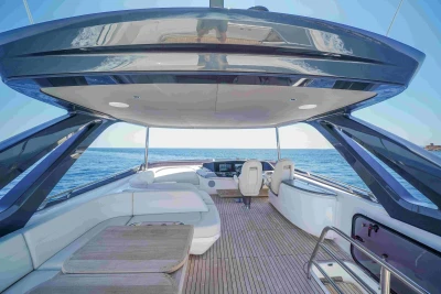 Luxurious 2023 Princess S72 yacht deck with elegant seating and ocean view.