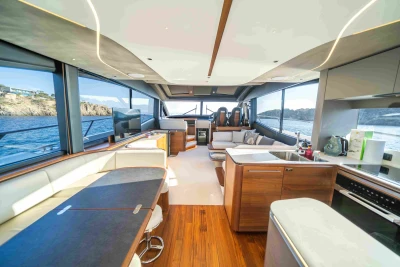 Luxurious interior of 2023 Princess S72 yacht with modern kitchen and scenic ocean views.