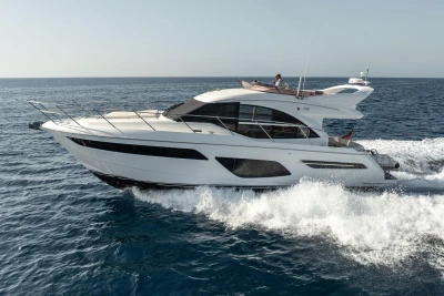 Luxurious 2019 Princess F50 yacht cruising on open sea.