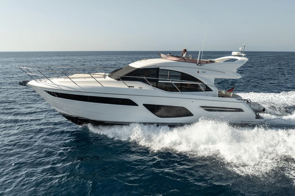 Luxurious 2019 Princess F50 yacht cruising on open sea.