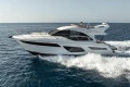 Luxurious 2019 Princess F50 yacht cruising on open sea.
