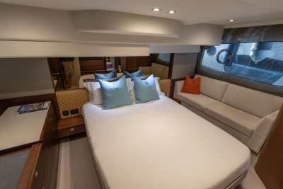 Luxurious 2019 Princess F50 yacht bedroom with elegant decor and comfortable seating.