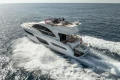 Luxurious 2019 Princess F50 yacht cruising on open sea, creating waves.