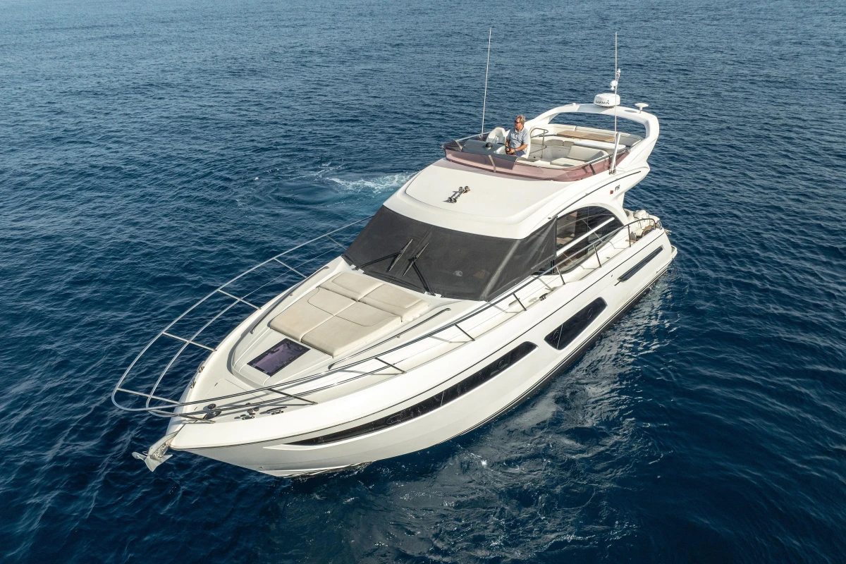 Luxurious 2019 Princess F50 yacht cruising on open sea.