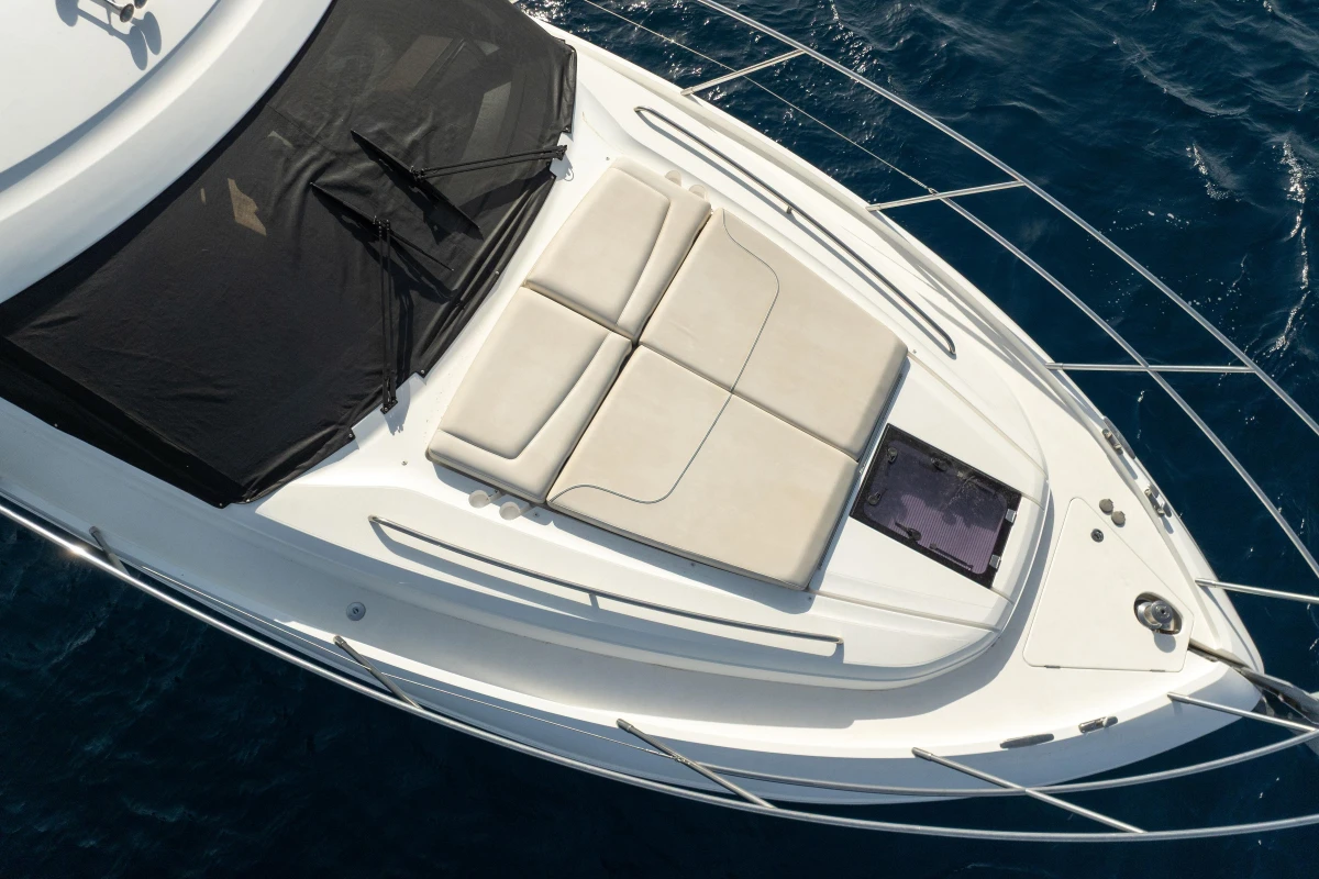 2019 Princess F50 yacht with sunbathing area, cruising on blue ocean waters.