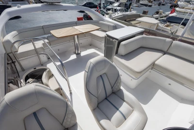 Luxurious 2019 Princess F50 yacht interior with elegant seating and table setup.