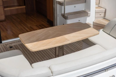 Luxurious interior of 2019 Princess F50 yacht with elegant wooden table and seating.