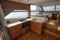 Luxurious 2019 Princess F50 yacht interior with modern kitchen and dining area.