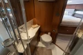 Luxurious 2019 Princess F50 yacht bathroom with modern fixtures and adjacent bedroom.