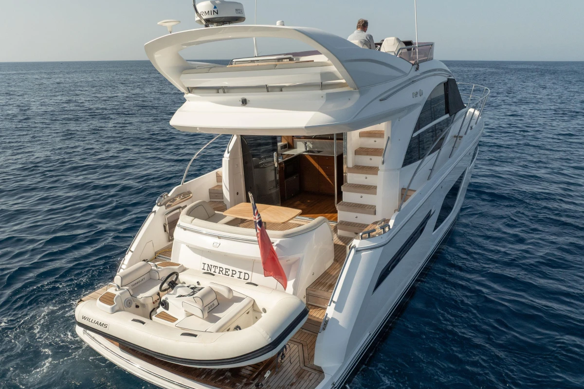2019 Princess F50 yacht on open sea, featuring luxurious deck and tender boat.