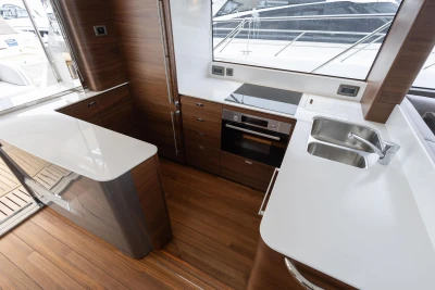 Modern kitchen interior on 2026 Princess F65 yacht with sleek countertops and appliances.